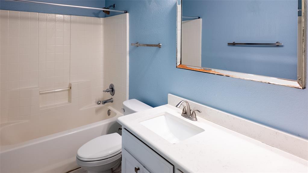 124 Topaz Circle Hewitt, TX 76643 - Photo 20 of 29 Bathroom featuring vanity, a textured wall, and tub / shower combination