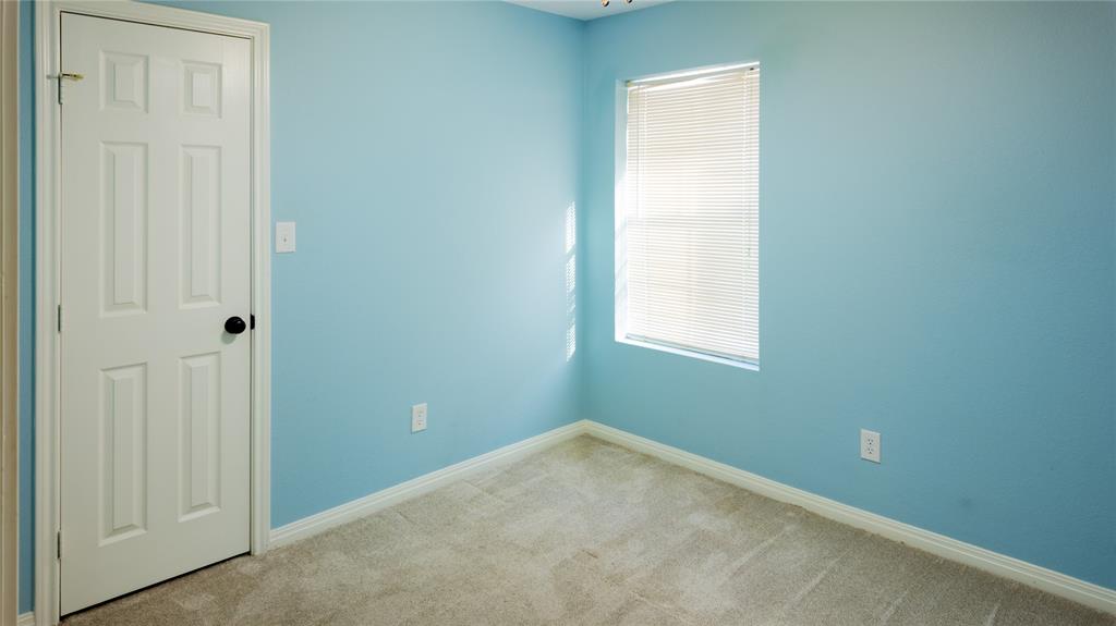 124 Topaz Circle Hewitt, TX 76643 - Photo 21 of 29 Empty room with light colored carpet and baseboards