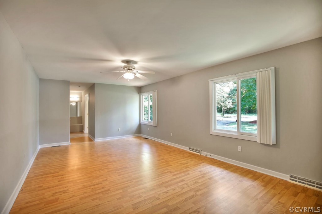14060 Beach Road Chesterfield, VA 23838 - Photo 15 of 24 a view of an empty room with window and wooden floor
