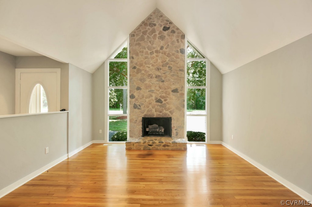 14060 Beach Road Chesterfield, VA 23838 - Photo 3 of 24 a view of a livingroom with wooden floor a fireplace and windows
