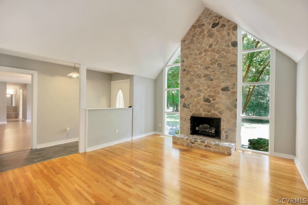 14060 Beach Road Chesterfield, VA 23838 - Photo 4 of 24 a spacious bedroom with a bed and a fireplace