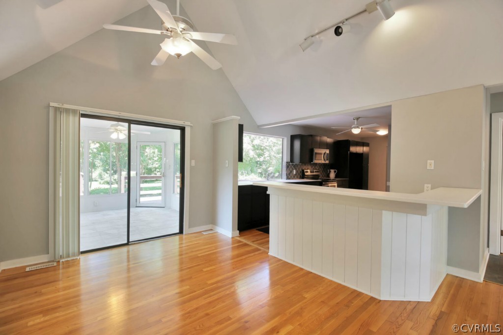 14060 Beach Road Chesterfield, VA 23838 - Photo 6 of 24 a view of a kitchen with furniture and wooden floor