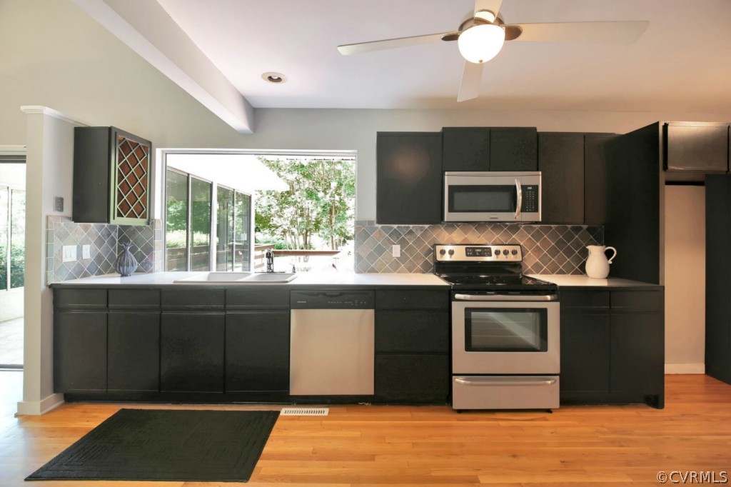 14060 Beach Road Chesterfield, VA 23838 - Photo 8 of 24 a kitchen with stainless steel appliances granite countertop a stove a sink and a refrigerator