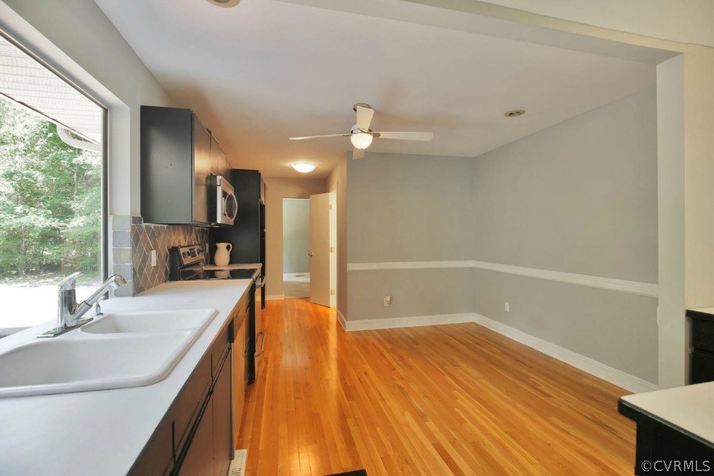 14060 Beach Road Chesterfield, VA 23838 - Photo 9 of 24 a bathroom with a sink a large mirror and shower