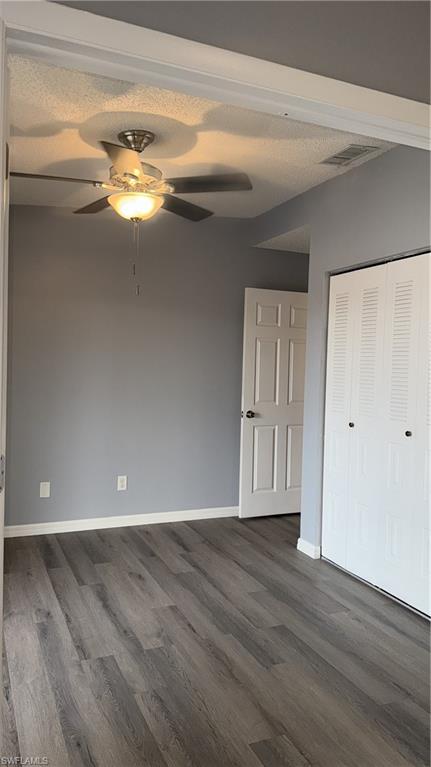 6492 Royal Woods Drive, Unit 5 Fort Myers, FL 33908 - Photo 12 of 28 wooden floor in an empty room with a window