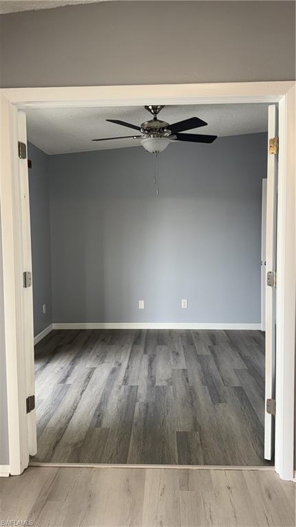 6492 Royal Woods Drive, Unit 5 Fort Myers, FL 33908 - Photo 13 of 28 view of wooden floor