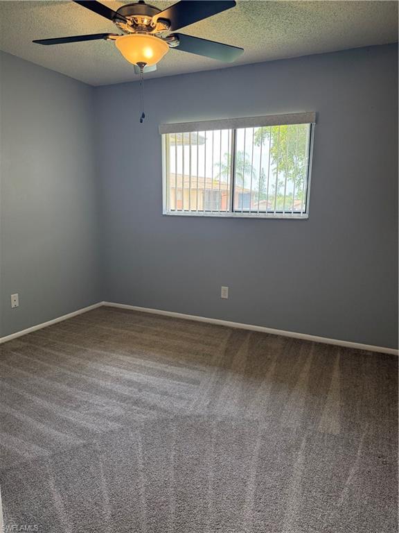 6492 Royal Woods Drive, Unit 5 Fort Myers, FL 33908 - Photo 14 of 28 a view of an empty room with a window