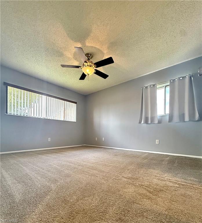 6492 Royal Woods Drive, Unit 5 Fort Myers, FL 33908 - Photo 15 of 28 a view of an empty room with windows