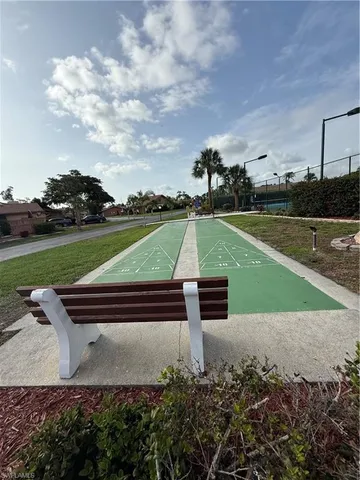 a view of road with palm trees