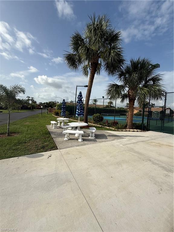 6492 Royal Woods Drive, Unit 5 Fort Myers, FL 33908 - Photo 28 of 28 a view of road with palm trees
