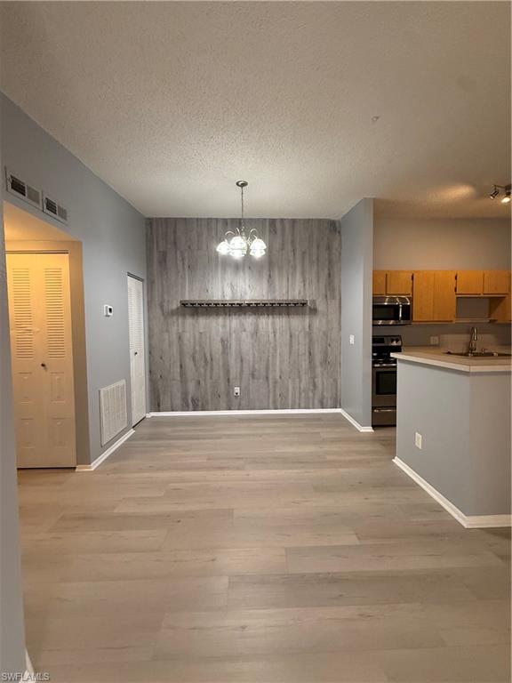 6492 Royal Woods Drive, Unit 5 Fort Myers, FL 33908 - Photo 6 of 28 a view of a kitchen with a sink and cabinets