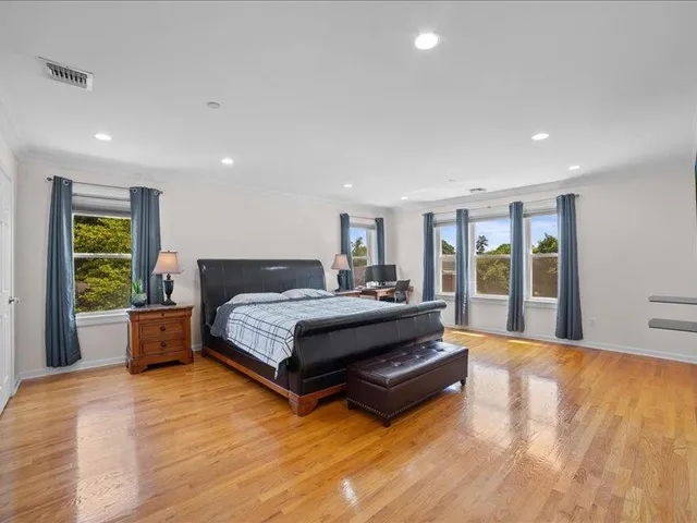 a room with gym equipment and windows