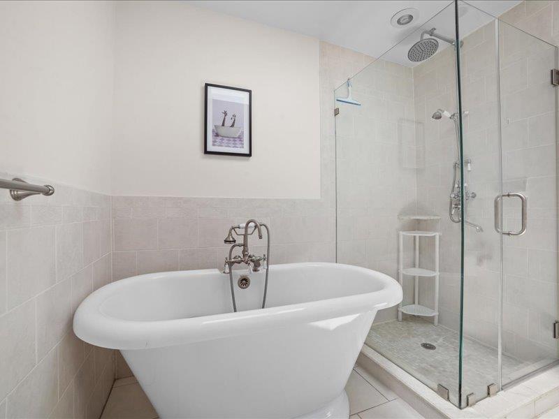 283 Harrison Avenue Harrison, NY 10528 - Photo 16 of 27 a white bath tub sitting next to a shower