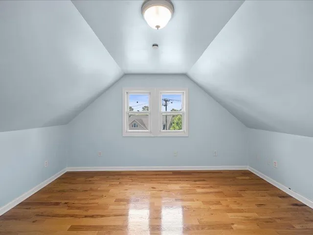 a spacious bathroom with a double vanity sink mirror and bathtub