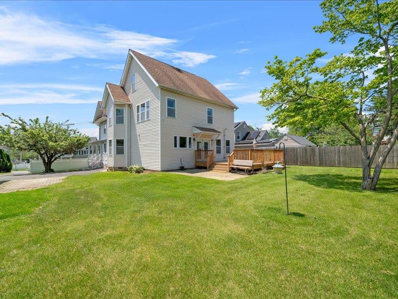 283 Harrison Avenue Harrison, NY 10528 - Photo 25 of 27 a view of a house with backyard and a tree
