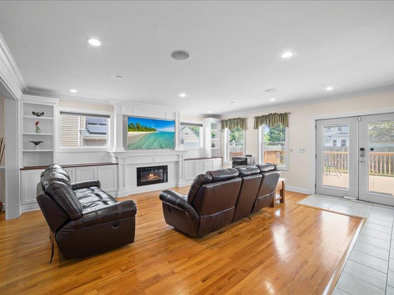 283 Harrison Avenue Harrison, NY 10528 - Photo 7 of 27 a living room with fireplace furniture and a wooden floor