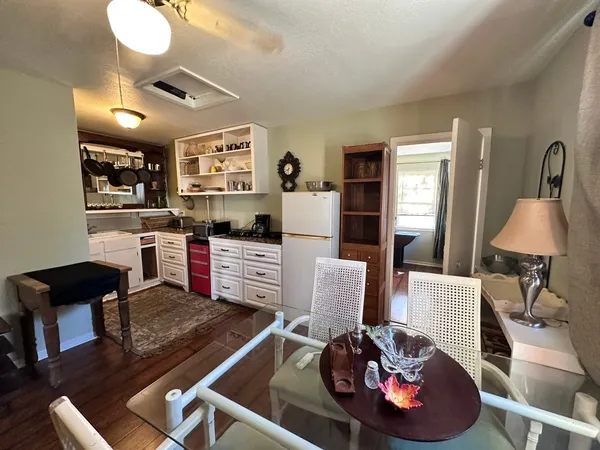 a living room with furniture and a lamp