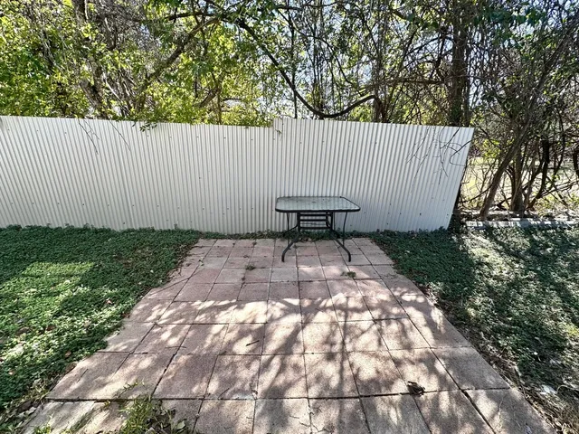 a view of a backyard with a small cabin