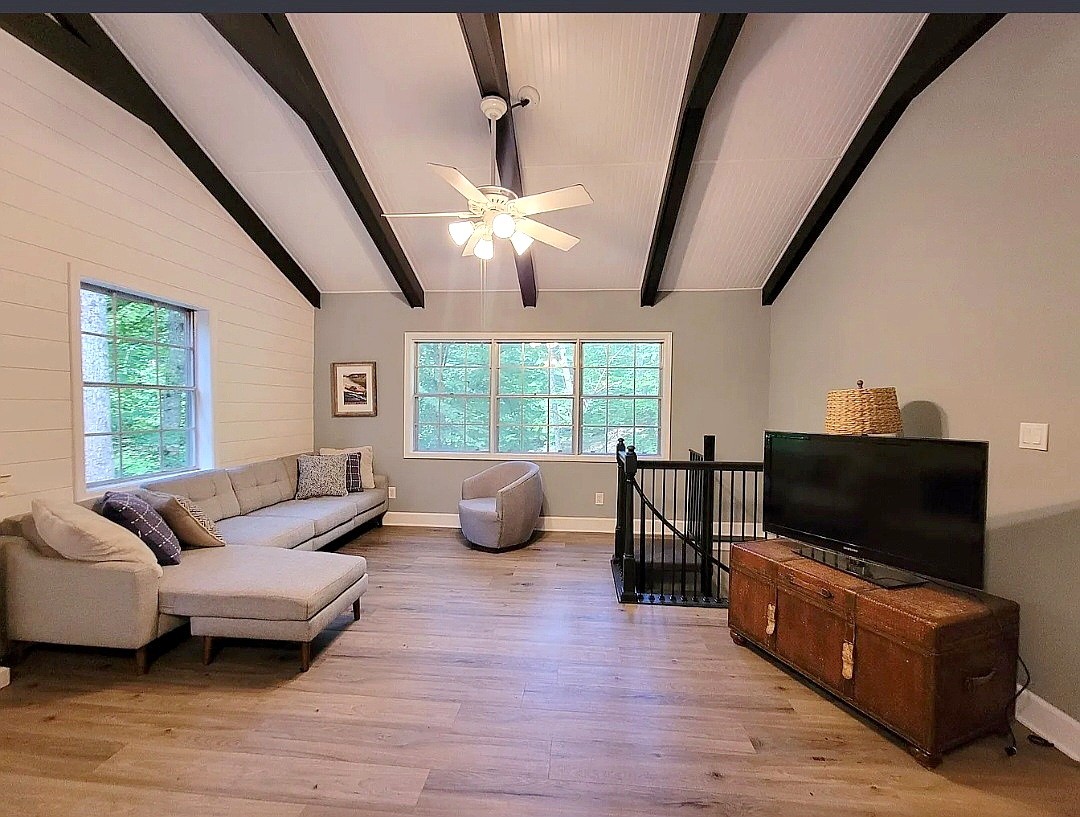1377 4 Seasons Road Smithville, TN 37166 - Photo 3 of 16 a living room with furniture and a flat screen tv