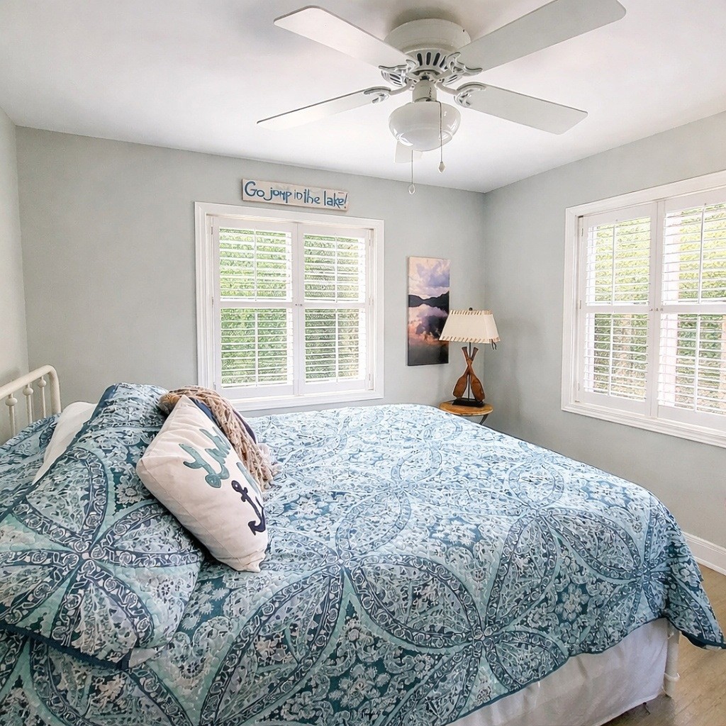 1377 4 Seasons Road Smithville, TN 37166 - Photo 5 of 16 a bedroom with a large bed and a window