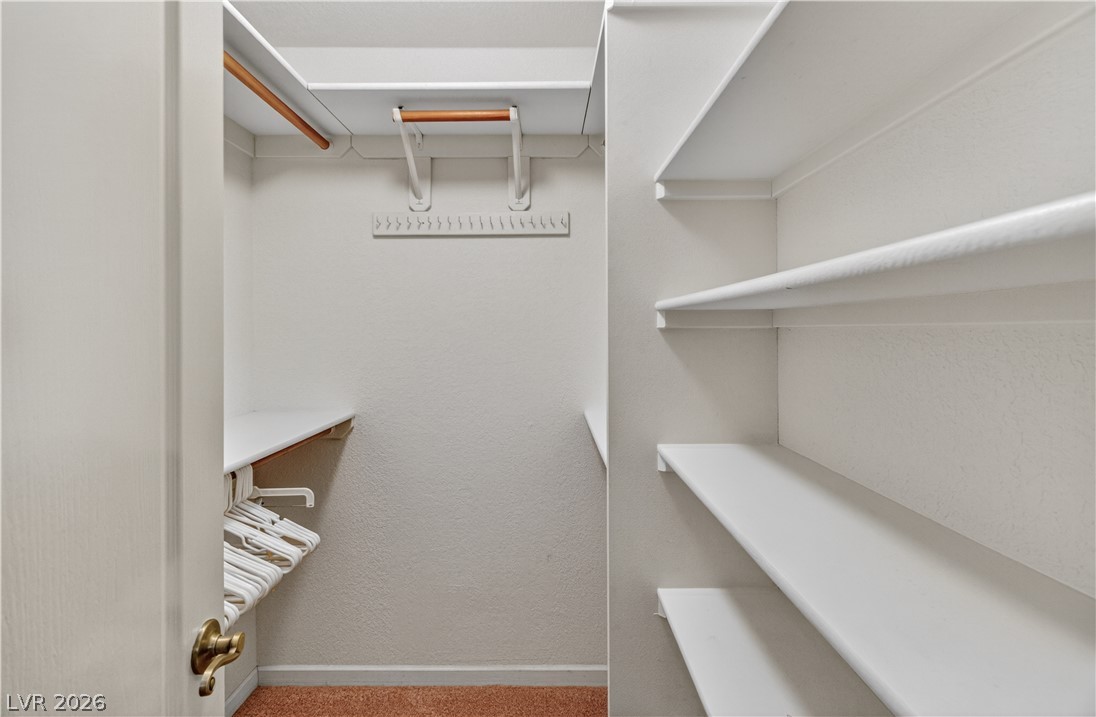 2055 Cholla Way Laughlin, NV 89029 - Photo 31 of 87 Functional closet system featuring ample shelving and hanging rods for organized storage.