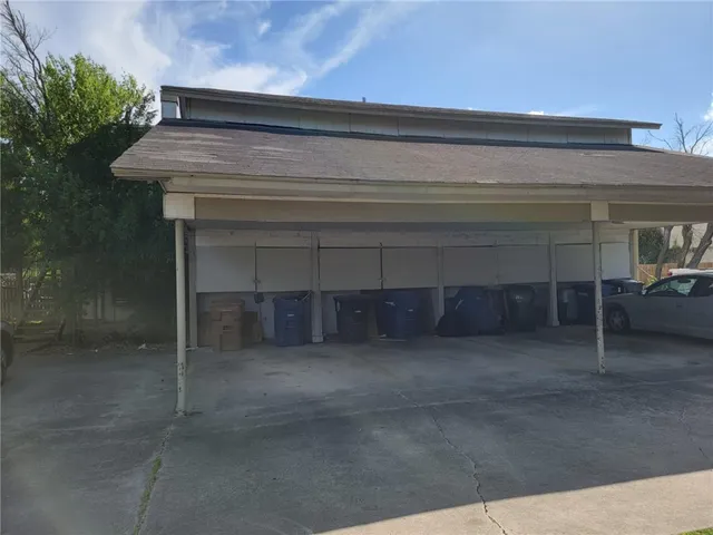 a view of backyard with a fireplace and a potted plant