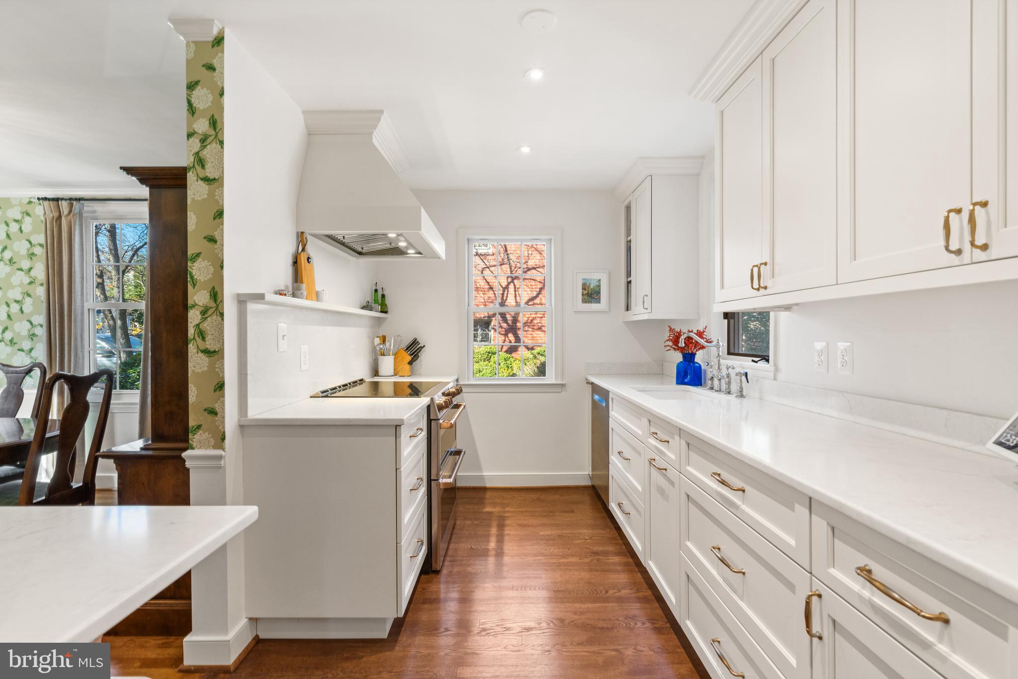5009 Allan Road Bethesda, MD 20816 - Photo 11 of 65 a kitchen with a white stove top oven sink and cabinets