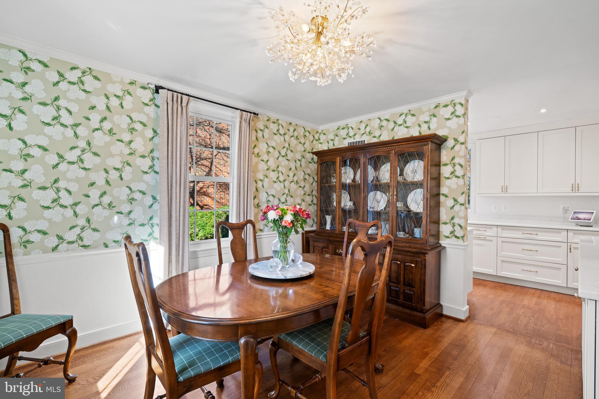 5009 Allan Road Bethesda, MD 20816 - Photo 17 of 65 a view of a dining room with furniture window and wooden floor