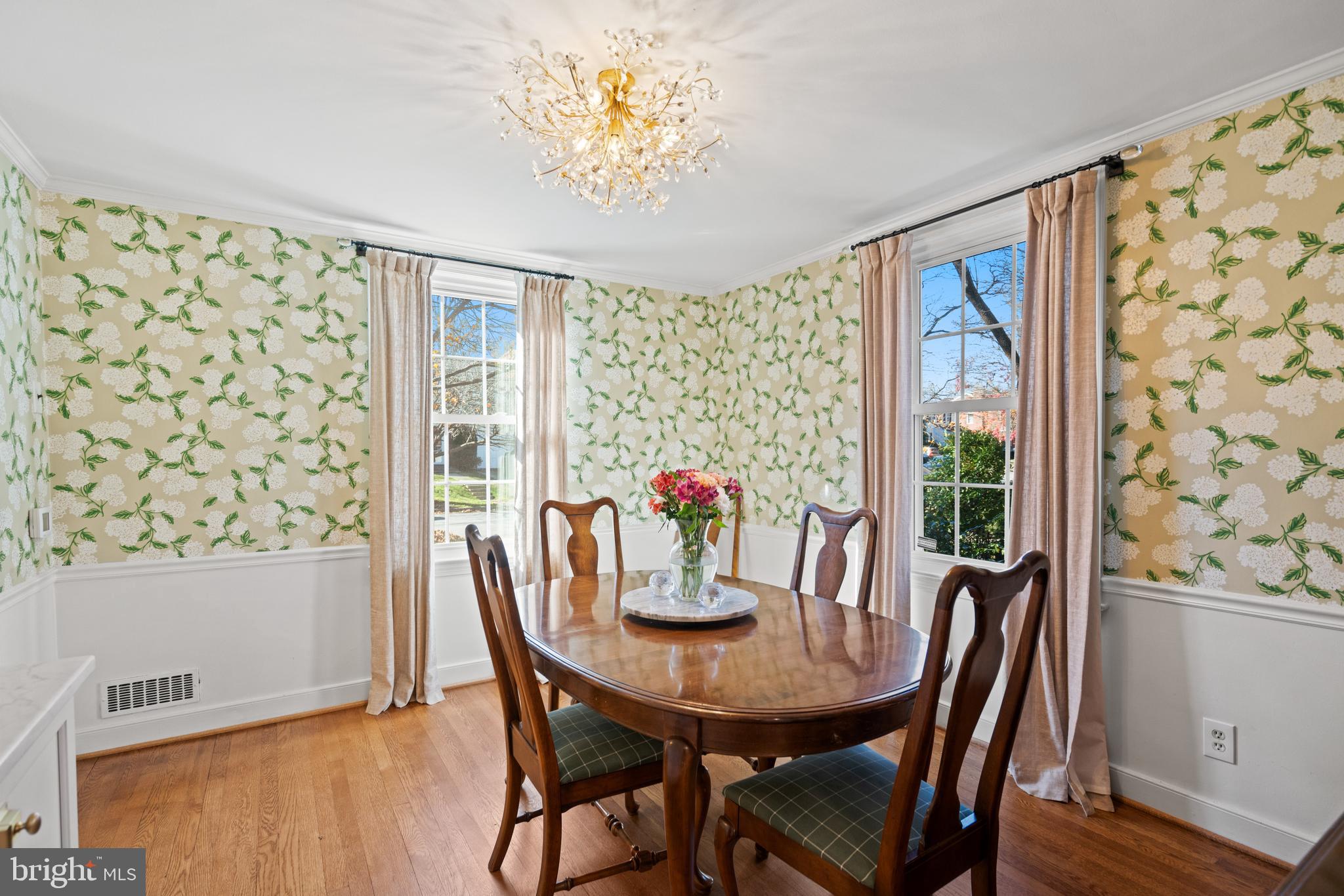 5009 Allan Road Bethesda, MD 20816 - Photo 19 of 65 a view of a dining room with furniture window and wooden floor