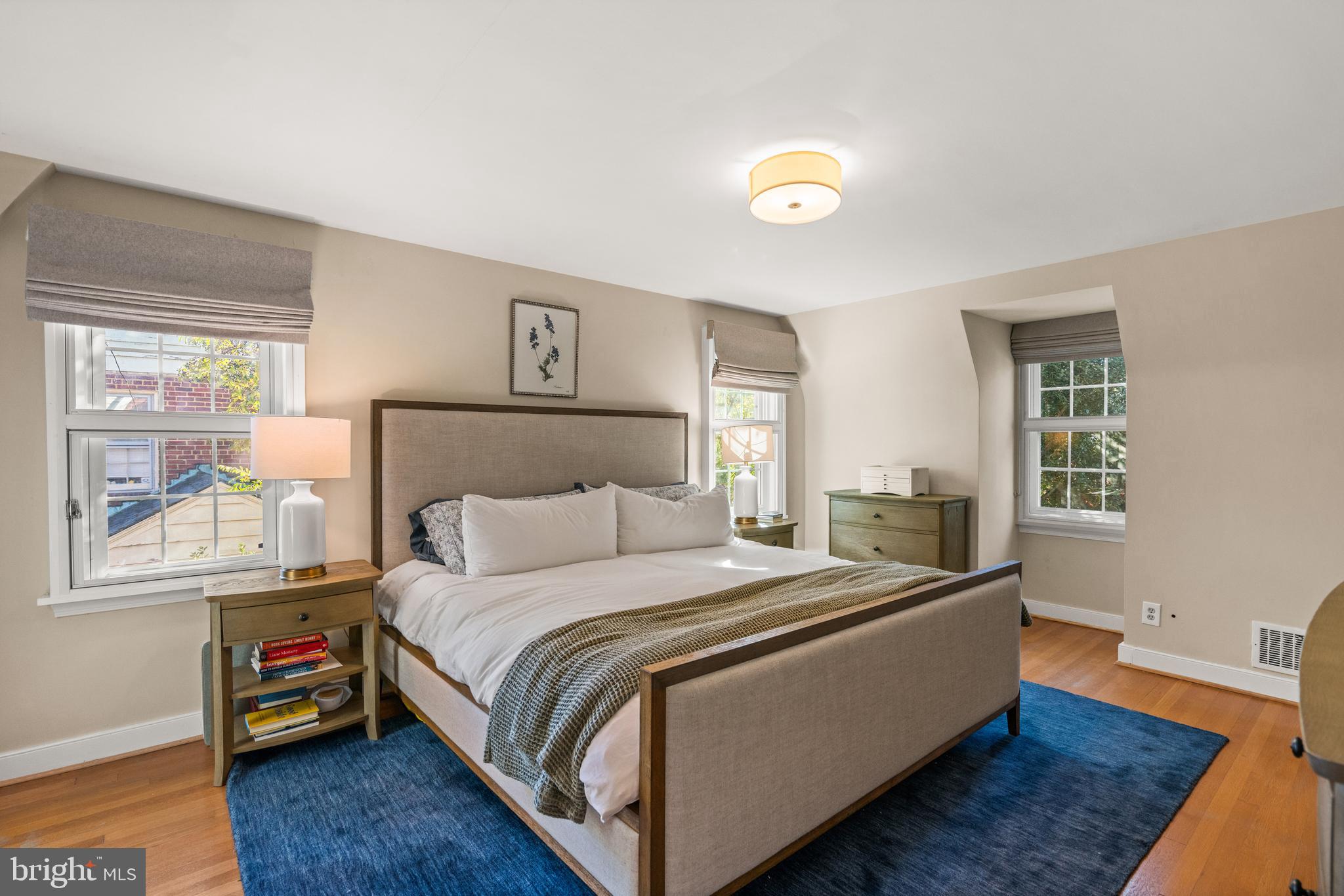 5009 Allan Road Bethesda, MD 20816 - Photo 30 of 65 a bedroom with a bed and wooden floor