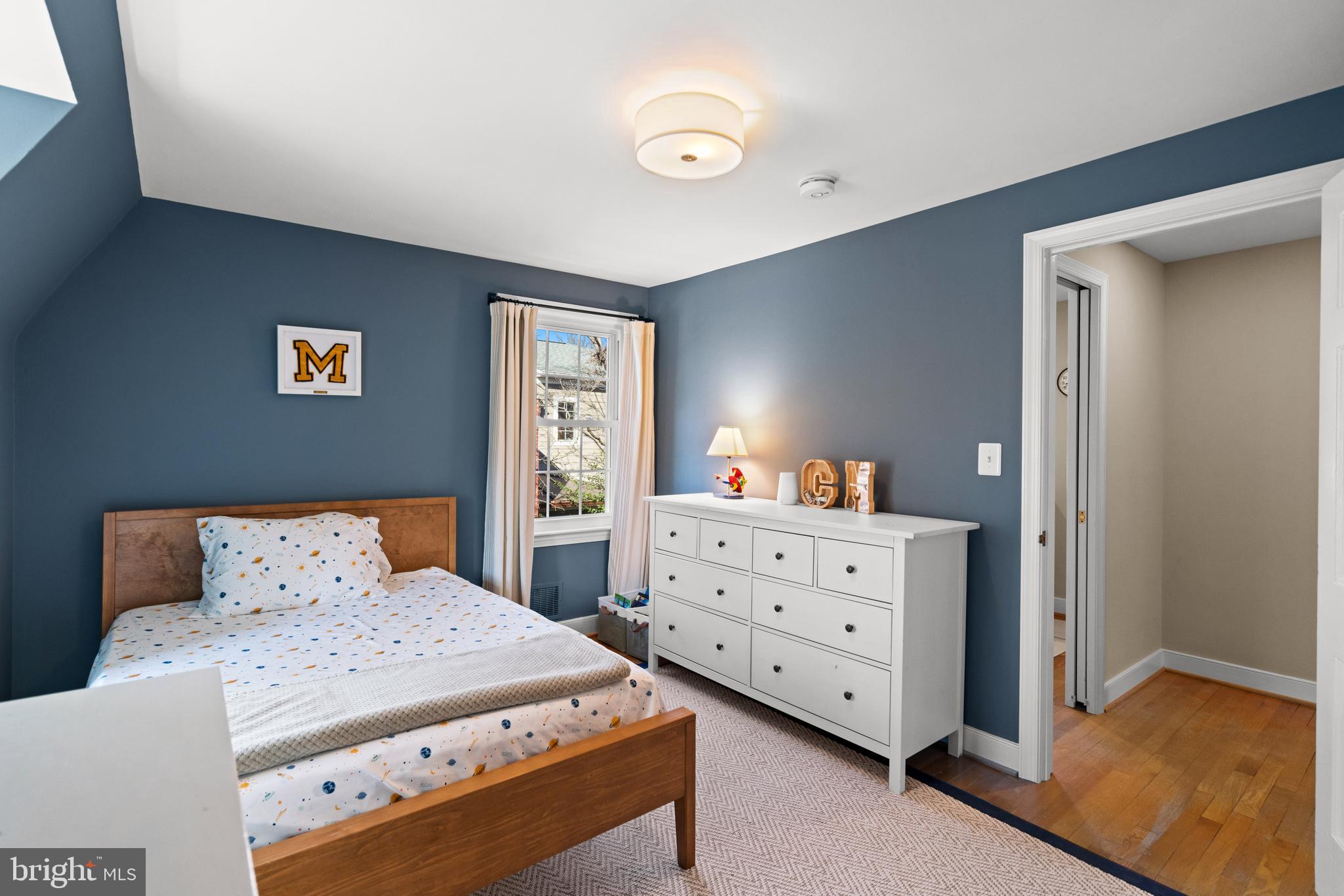 5009 Allan Road Bethesda, MD 20816 - Photo 38 of 65 a bedroom with a bed and a dresser