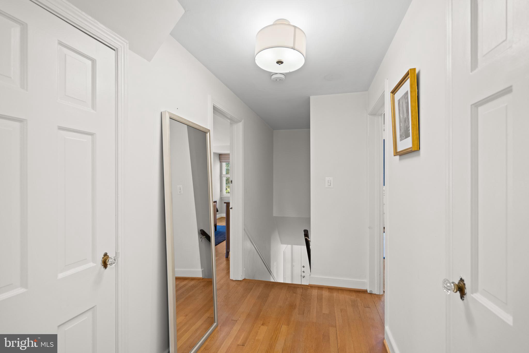 5009 Allan Road Bethesda, MD 20816 - Photo 42 of 65 a view of a hallway with wooden floor and closet area