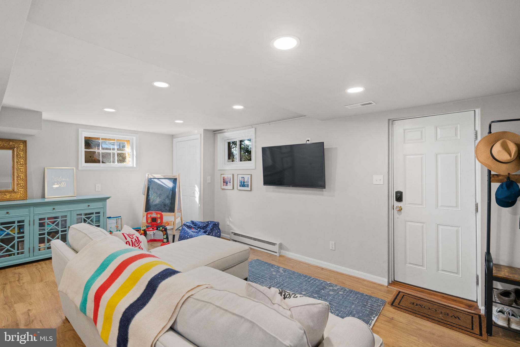 5009 Allan Road Bethesda, MD 20816 - Photo 45 of 65 a bed room with a bed a couch and a television