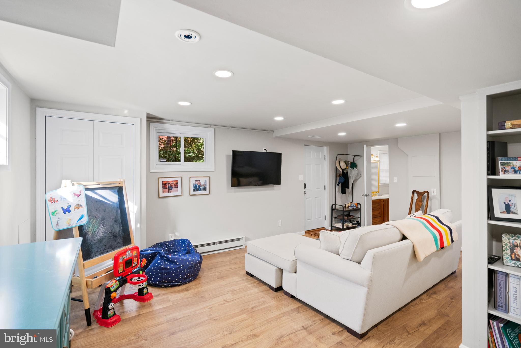 5009 Allan Road Bethesda, MD 20816 - Photo 46 of 65 a living room with furniture and a flat screen tv