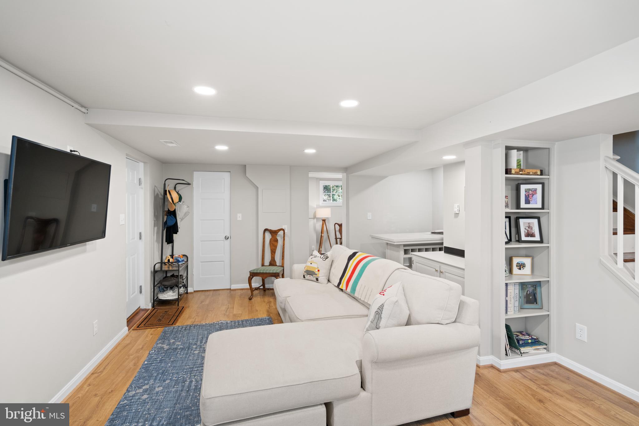 5009 Allan Road Bethesda, MD 20816 - Photo 47 of 65 a living room with furniture and a flat screen tv