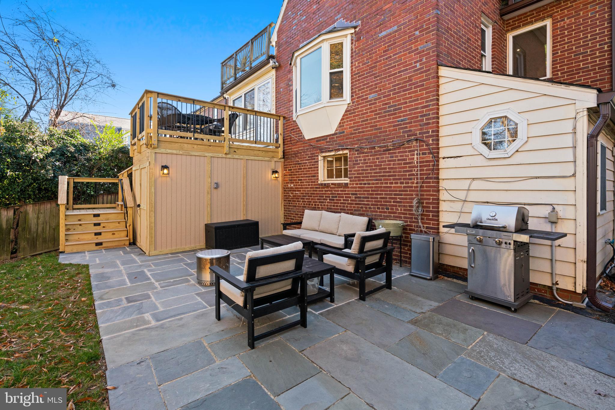 5009 Allan Road Bethesda, MD 20816 - Photo 58 of 65 a backyard of a house with barbeque oven table and chairs