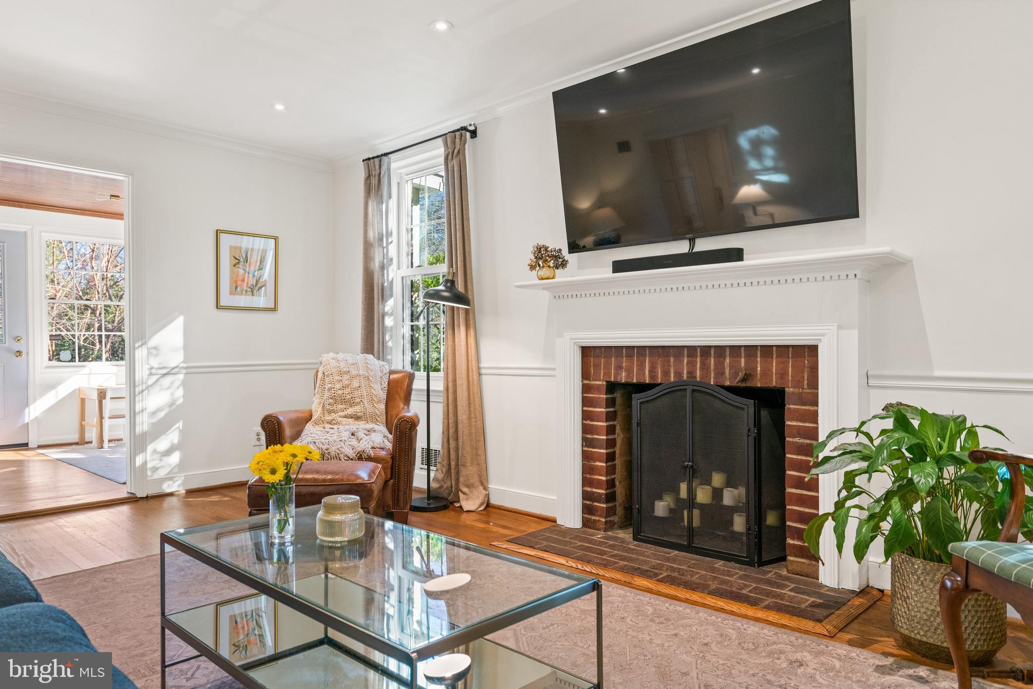 5009 Allan Road Bethesda, MD 20816 - Photo 7 of 65 a living room with furniture and a fireplace