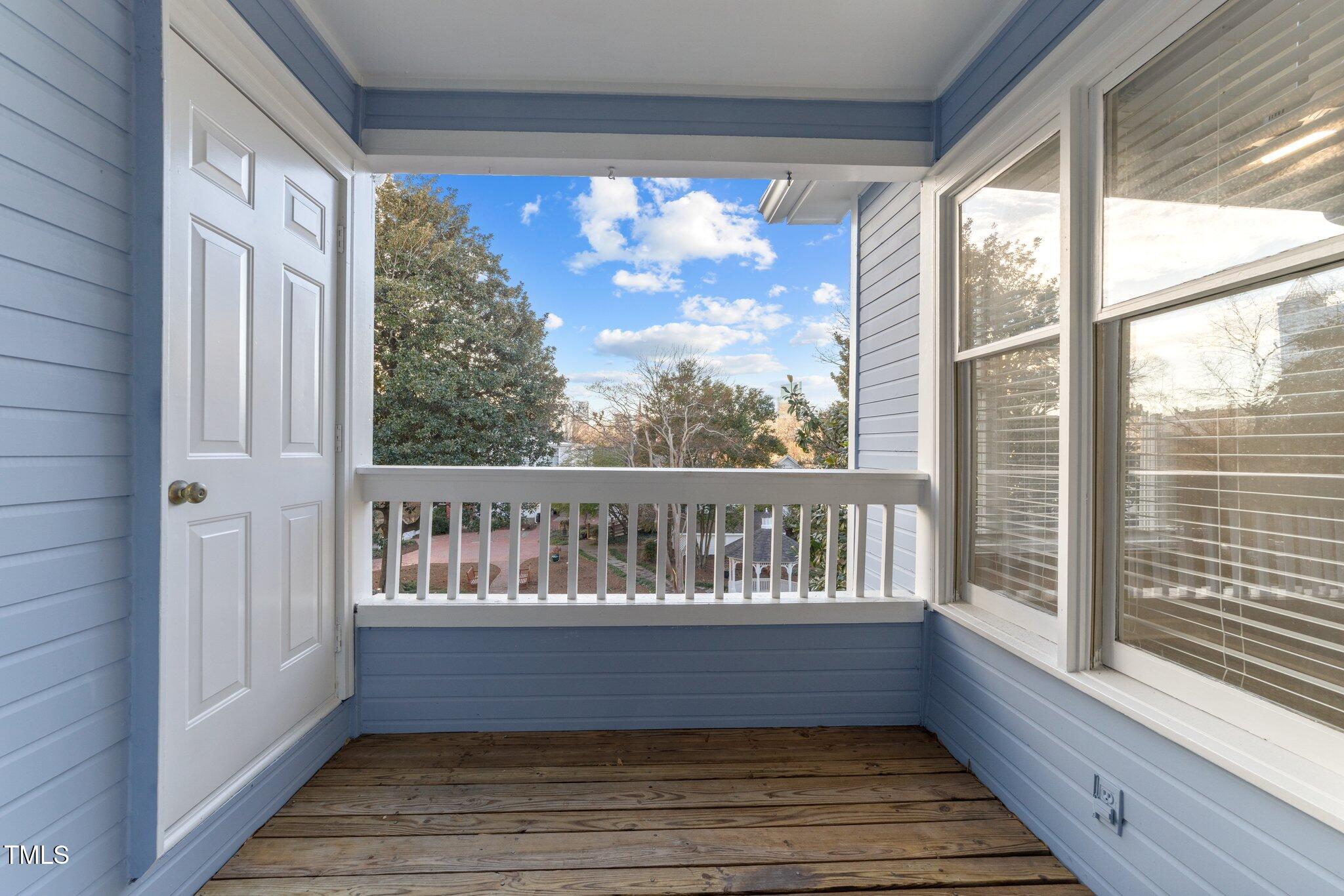 243 New Bern Place, Unit 301 Raleigh, NC 27601 - Photo 20 of 31 a view of balcony with wooden floor