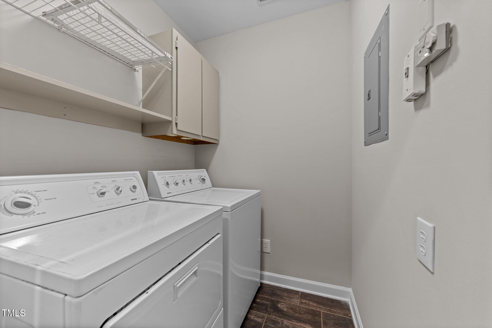 243 New Bern Place, Unit 301 Raleigh, NC 27601 - Photo 23 of 31 a utility room with dryer and washer