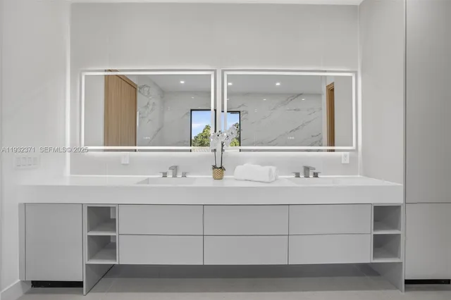 a bathroom with a sink and a mirror