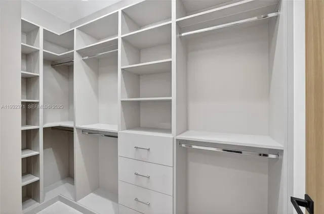 a view of an empty walk in closet