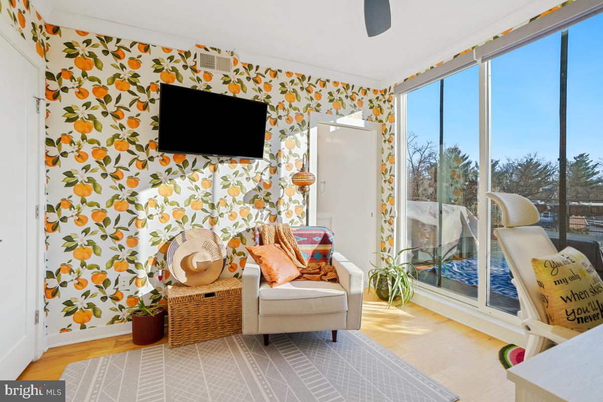 111 Varnum Street Northwest, Unit 3 Washington, DC 20011 - Photo 11 of 21 a living room with furniture and a flat screen tv