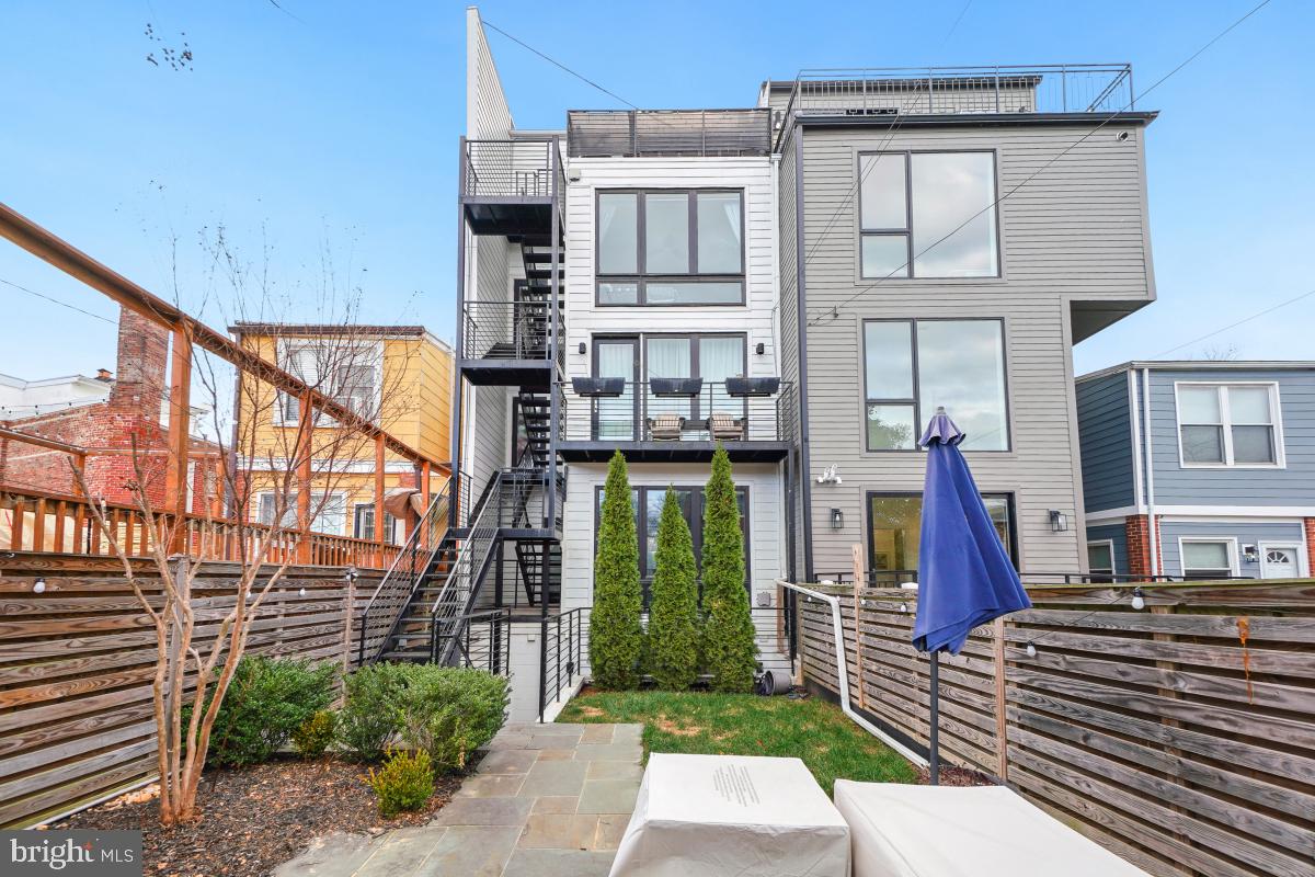 111 Varnum Street Northwest, Unit 3 Washington, DC 20011 - Photo 21 of 21 a front view of a house with a yard
