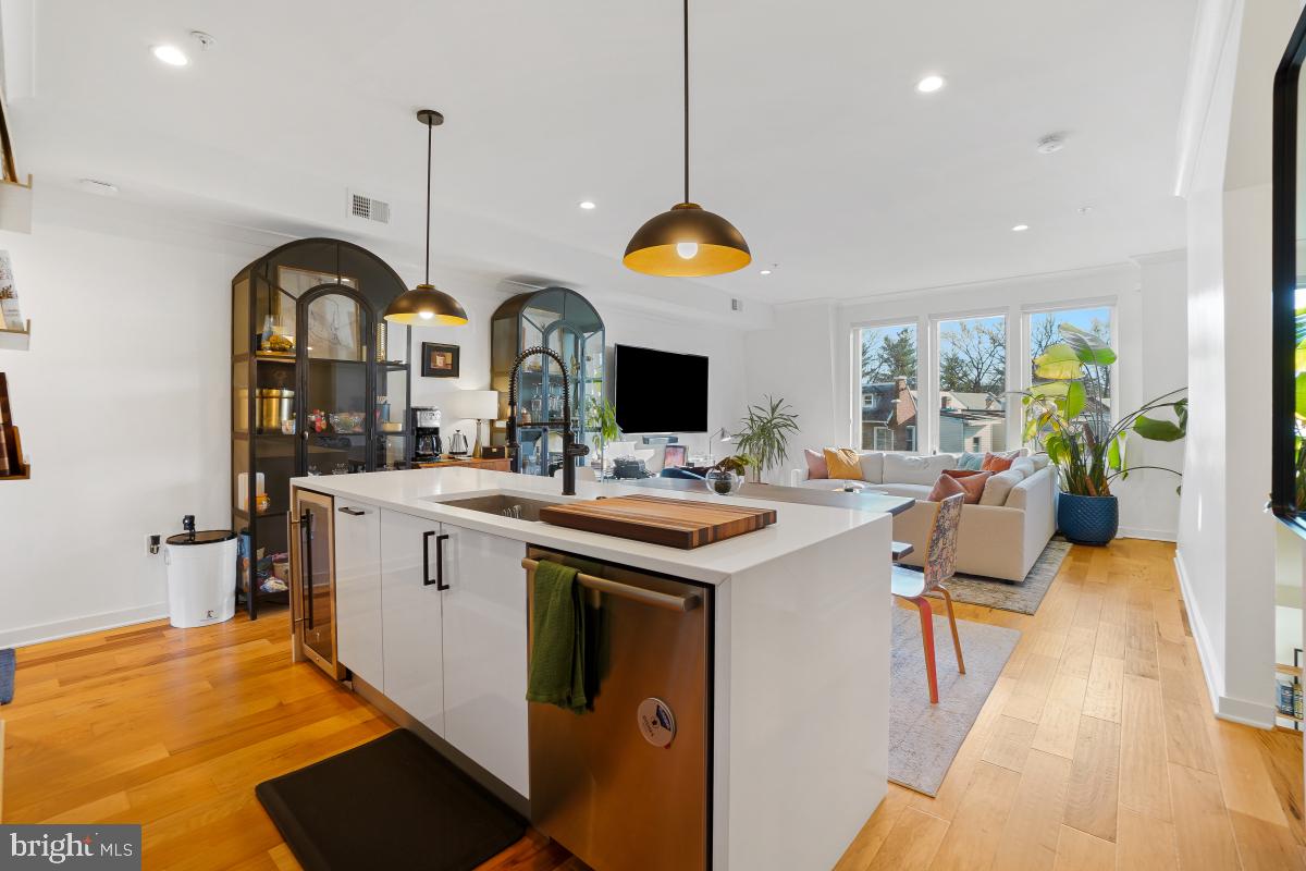 111 Varnum Street Northwest, Unit 3 Washington, DC 20011 - Photo 7 of 21 a view of kitchen with stainless steel appliances granite countertop a stove and a sink