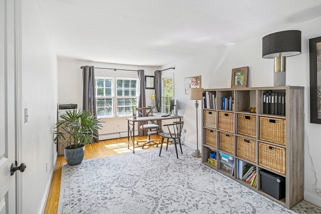28 Longmeadow Road Arlington, MA 02474 - Photo 11 of 25 wooden floor in a room with a book shelf