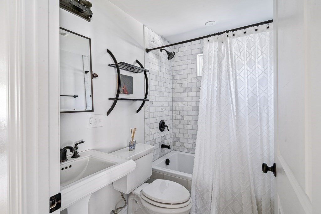 28 Longmeadow Road Arlington, MA 02474 - Photo 12 of 25 a bathroom with a sink a toilet and shower