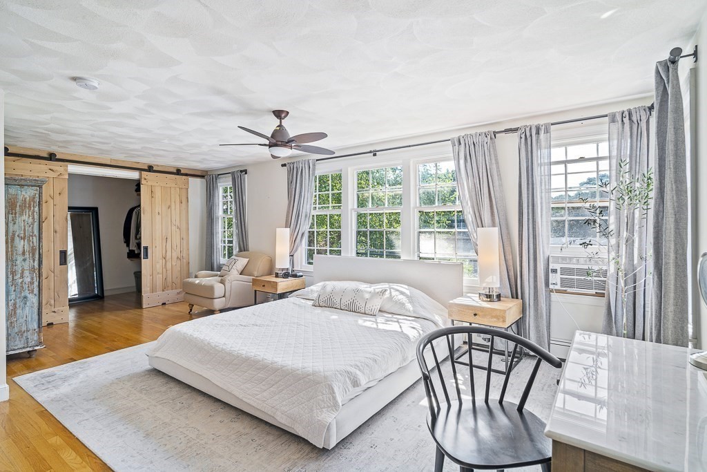 28 Longmeadow Road Arlington, MA 02474 - Photo 13 of 25 a bedroom with a bed and a table in it