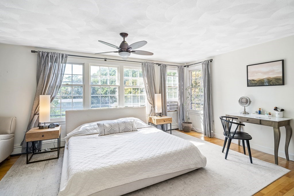 28 Longmeadow Road Arlington, MA 02474 - Photo 14 of 25 a bedroom with a bed and a desk