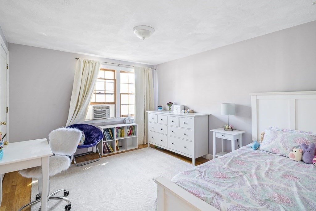 28 Longmeadow Road Arlington, MA 02474 - Photo 17 of 25 a bedroom with a bed and a dresser