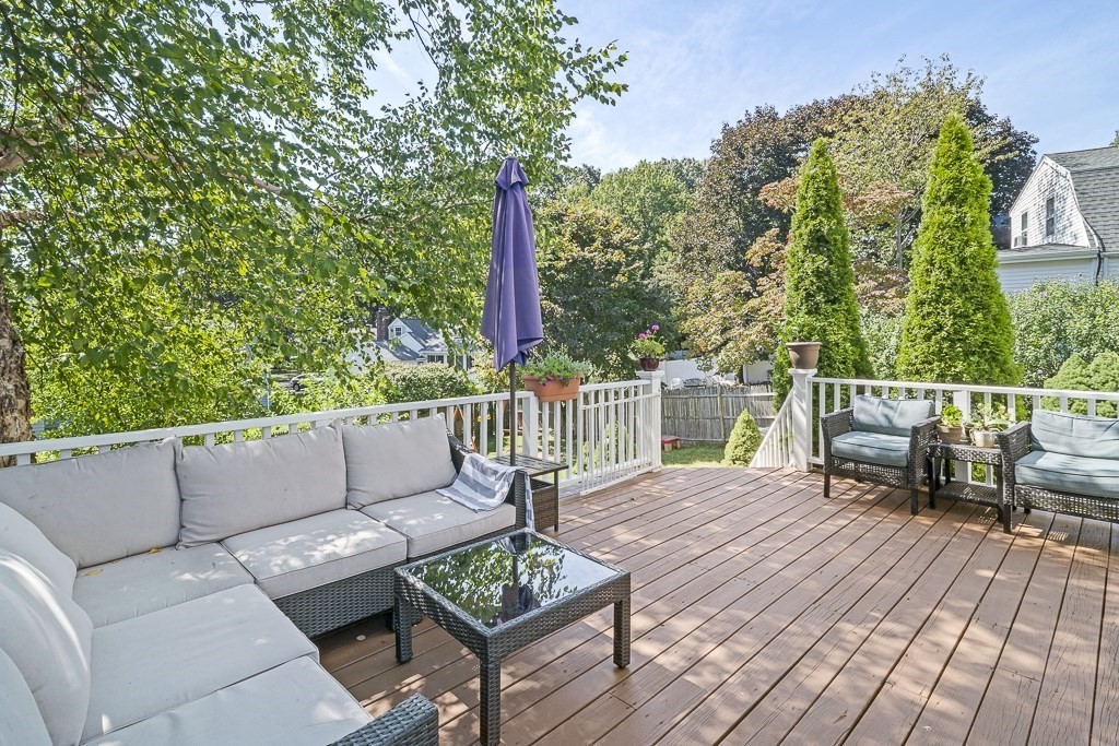 28 Longmeadow Road Arlington, MA 02474 - Photo 20 of 25 a balcony with wooden floor and outdoor seating